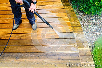 Cleaning terrace with a power washer - high water pressure clean Stock Photo