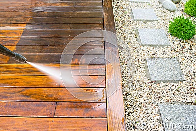 Cleaning terrace with a power washer Stock Photo