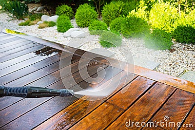 Cleaning terrace with a power washer Stock Photo