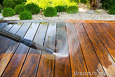 Cleaning terrace with a power washer Stock Photo