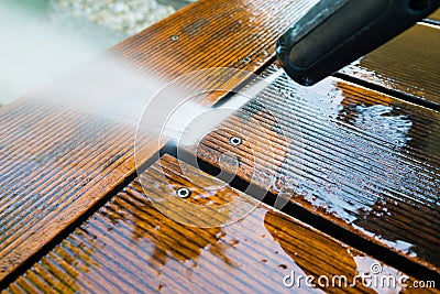 Cleaning terrace with a power washer Stock Photo