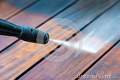 Cleaning terrace with a power washer Stock Photo