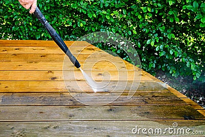 cleaning terrace with a power washer - high water pressure clean Stock Photo