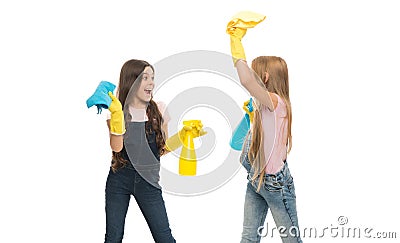 Cleaning their home naturally. Little cleaning ladies. Adorable children providing domestic cleaning with sprayers and Stock Photo