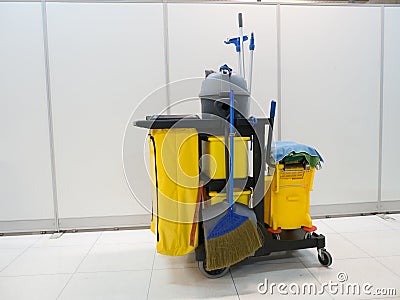 Cleaning tools cart wait for cleaning.Bucket and set of cleaning equipment in the office. janitor service janitorial for your Stock Photo