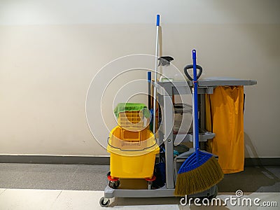 Cleaning tools cart wait for cleaner. Bucket and set of cleaning equipment in the Department store. janitor service janitorial for Stock Photo