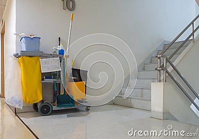 Cleaning tools cart wait for cleaner.Bucket and set of cleaning equipment in the apartment. janitor service janitorial for your pl Stock Photo