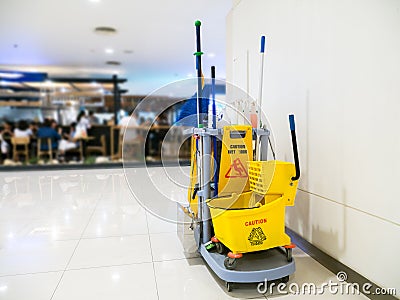 Cleaning tools cart wait for cleaning.Bucket and set of cleaning equipment in the Department store. Stock Photo