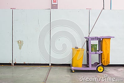 The cleaning trolley service cart in front of wall Stock Photo