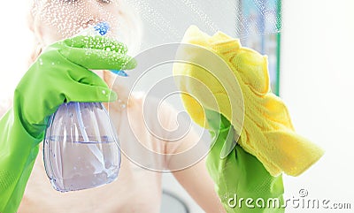 Cleaning window pane with detergent Stock Photo