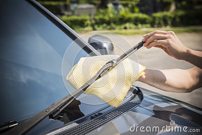 Cleaning a windshield wiper Stock Photo