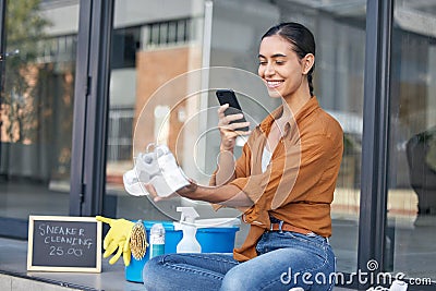 Cleaning woman, phone or shoes service on social media advertising, small business promotion or photograph on city road Stock Photo