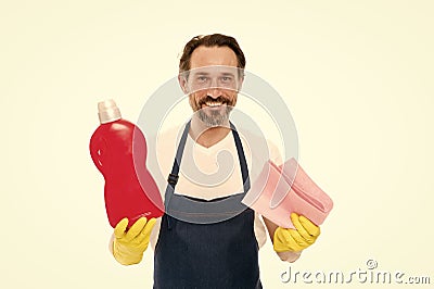 Cleanness is in his hands. Mature household helper. Mature household worker holding laundry detergent in rubber gloves Stock Photo