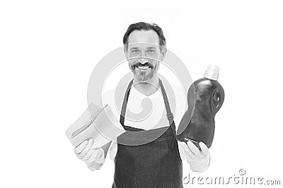 Cleanness is in his hands. Mature household helper. Mature household worker holding laundry detergent in rubber gloves Stock Photo