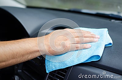 Cleansing car interior. Male hand disinfecting vihicle Stock Photo
