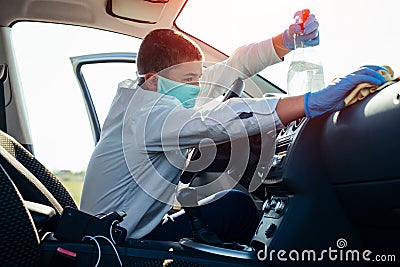 Cleansing car interior and spraying with disinfection liquid. Prevent infection of Covid-19 virus coronavirus. Stock Photo