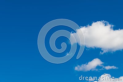 Clear azure blue sky background with group of romantic puffy white clouds Stock Photo