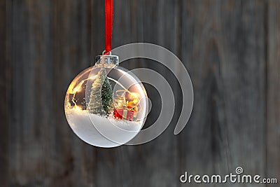 Clear Ball Ornament with christmas tree and small gift Stock Photo