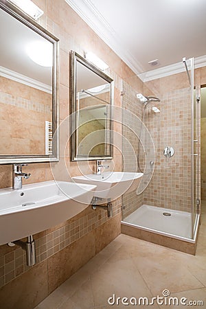 Clear and beige bathroom Stock Photo