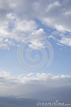 Clear blue sky between clouds in the bottom and top of image Stock Photo