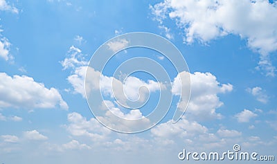 Clear blue sky with white fluffy clouds at noon. Day time. Abstract nature landscape background Stock Photo