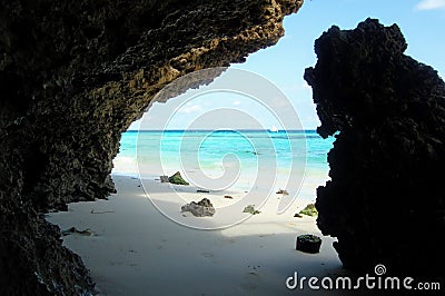 Clear blue waters and white sands between the cliffs of Nungwi beach, Zanzibar, Tanzania Stock Photo