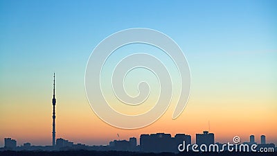 Clear blue and yellow dawning sky over city Stock Photo