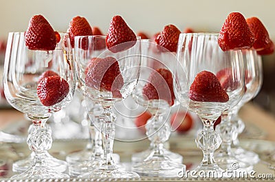 Strawberries decorate elegant crystal glasses Stock Photo