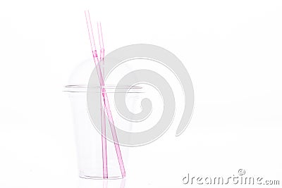Clear empty plastic cup with dome lid and two pink plastic straws for milkshake Stock Photo