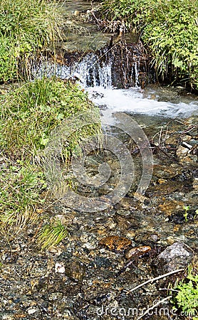 Clear fresh mountain water over stones Stock Photo