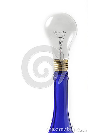 Clear light bulb on blue oil bottle Stock Photo