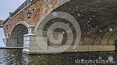 Clear Panorama Snowy view under the arched bridge of Oquirrh Lake Stock Photo