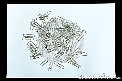 Clear paper and paper clip is isolated on black background Stock Photo