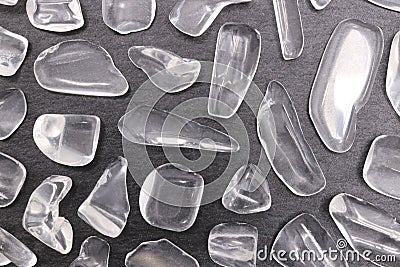 Clear quartz rare jewel on black stone texture Stock Photo