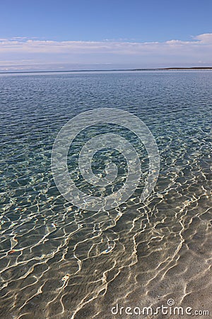Clear shallow water with beautiful caustics Stock Photo
