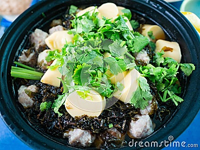 Clear Soup with Tofu, Seaweed, and Minced Pork, a popular dish in Thailand, can be found in street food stalls. It is a healthy Stock Photo