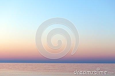 Clear sunset sky. Gradient background in pastel colors. Sunset over the sea. Stock Photo