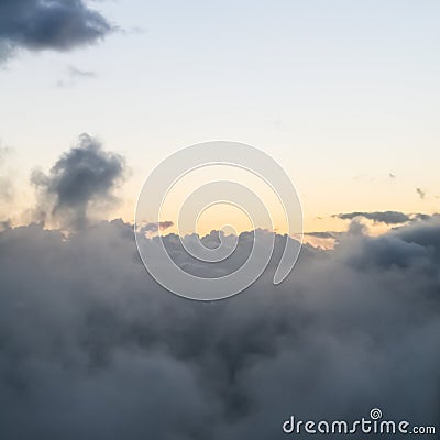 clear sunset sky over gray rainy clouds Stock Photo