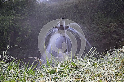 Clear sweet and health water overflowing from the water jet on rainy days Stock Photo