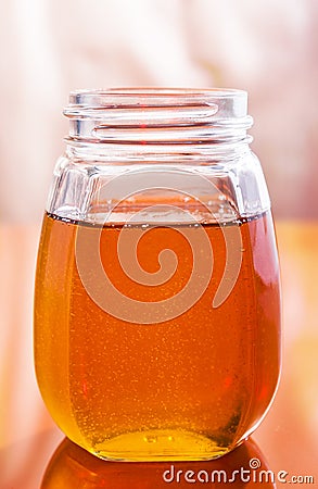 Clear sweet tasty honey jar Stock Photo