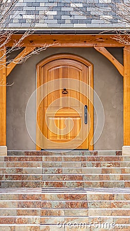Clear Vertical Entryway of home framed with leafless hibernating trees on the yard in winter Stock Photo