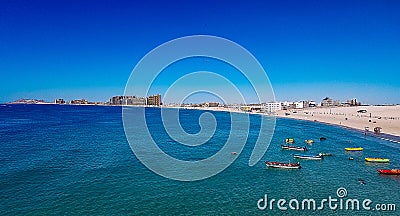 Clear Water and Boats at Sandy Beach, Rocky Point, Mexico Stock Photo