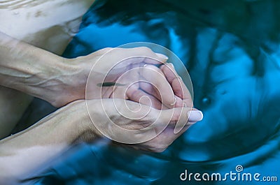 Clear water in the female palms Stock Photo
