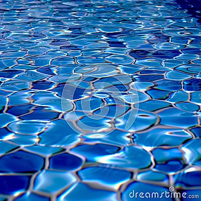 Clear water ripples over blue tiles, forming a mesmerizing abstract Stock Photo