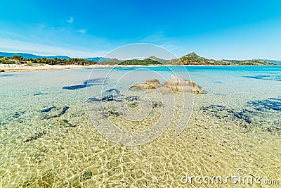 Clear water and rocks in Scoglio di Peppino beach Stock Photo