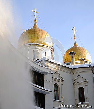 Clearing roofs from snow. Assumption church. Stock Photo