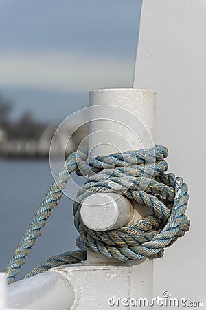 Cleated line securing docked fishing boat Stock Photo