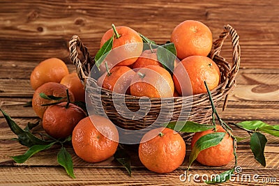 Clementines or mandarines organic fruits on a old wood Stock Photo