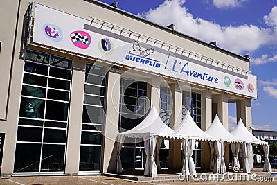 Michelin l`aventure logo sign and text on entrance corporate museum and Editorial Stock Photo