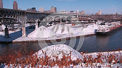 A bridge underlying the Cleveland Skyline - The Snowy Cuyahoga - CLEVELAND - OHIO - USA Editorial Stock Photo
